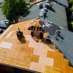 A bare roof in the process of having roofing installed, viewed from above.