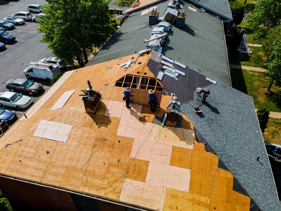 A bare roof in the process of having roofing installed, viewed from above.