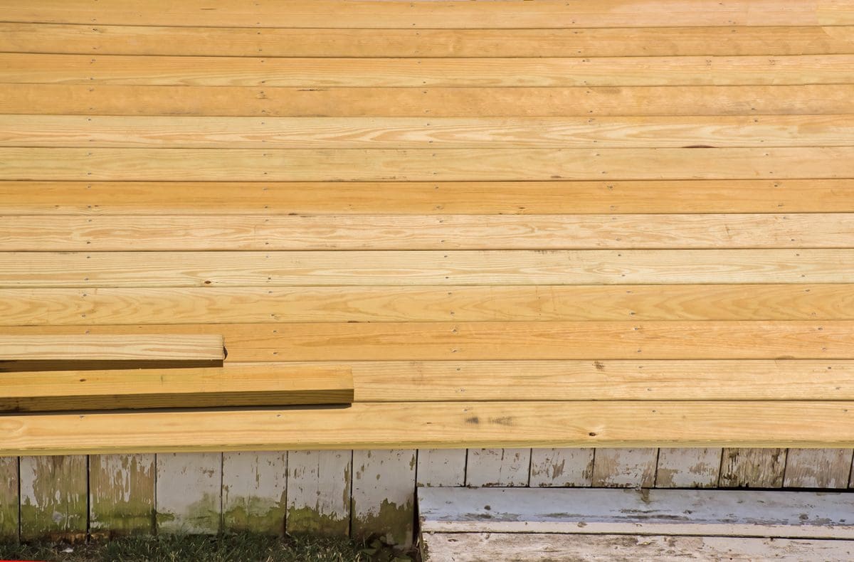 A newly installed deck made of pressure-treated wood