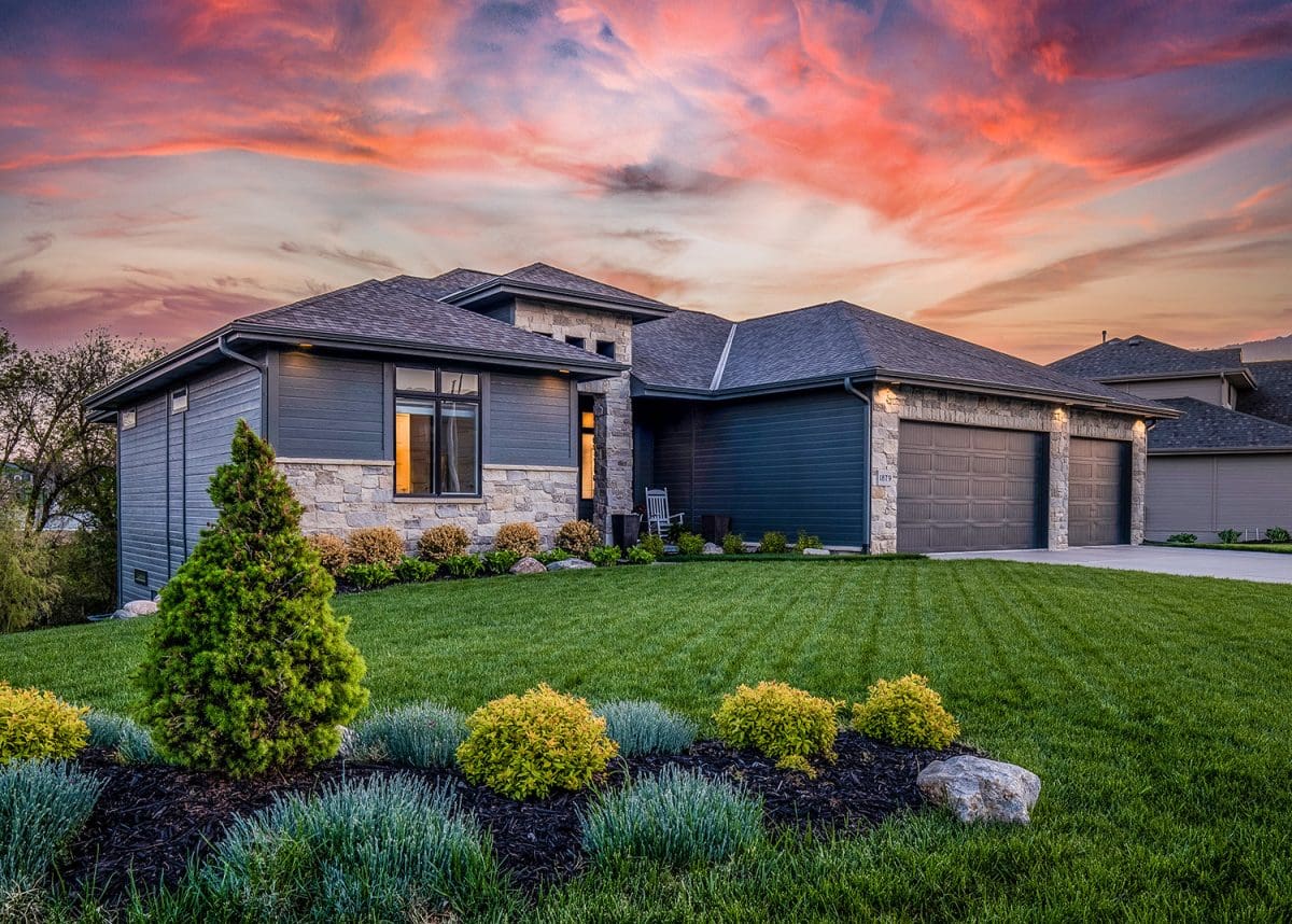 A home with a hip-style roof made with multiple tiers of roofing