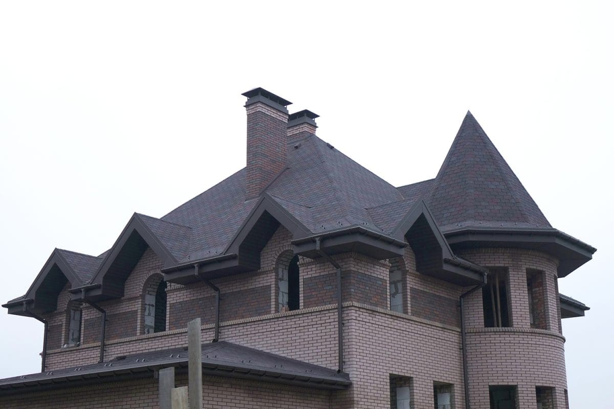 A large Victorian-style home with a purple roof