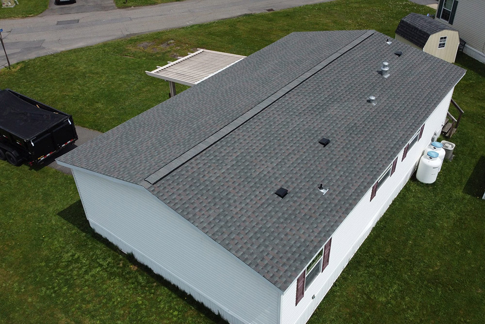 A birds-eye view of a home with a new roof.