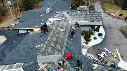 Residential roof replacement team working on a home in Northeastern PA